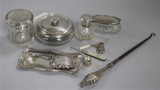 Three silver topped jars and a perfume bottle